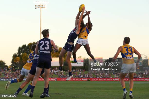 Joel Hamling of the Dockers marks the ball against Liam Ryan of the Eagles during the JLT Community Series AFL match between the Fremantle Dockers...