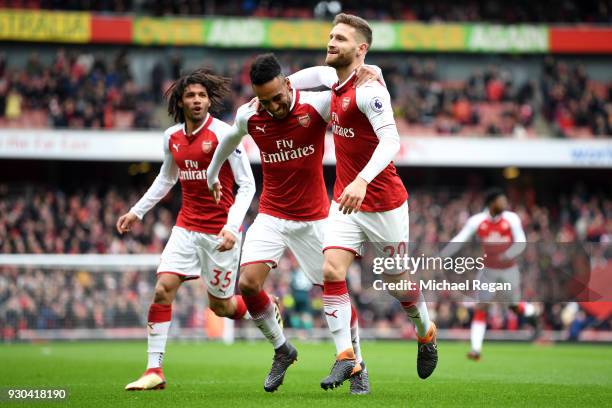 Shkodran Mustafi of Arsenal celebrates coring the first goal with Pierre-Emerick Aubameyang of Arsenal and Mohamed Elneny of Arsenal during the...