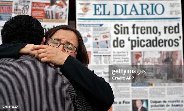 Blanca Alicia Martinez de la Rocha , widow of Mexican journaslist Armando Rodriguez, embraces a friend during a demonstration one year after he was...