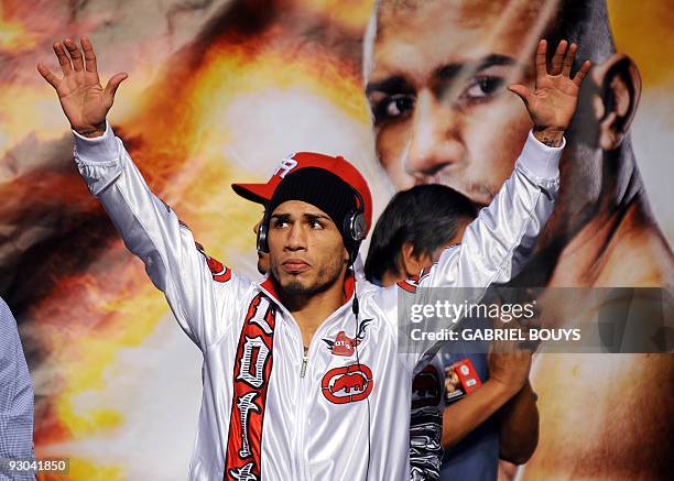 Champion Miguel Cotto of Puerto Rico poses during the official weigh-in for his fight against Welterweight boxing champion Manny "PacMan" Pacquiao of...