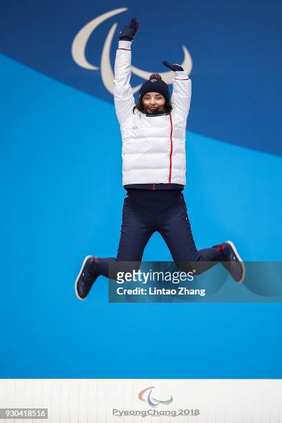 Gold Medalist Marie Bochet of France celebrate during the victory ceremony of the Women's Super-G Standing Alpine Skiing during day two of the...