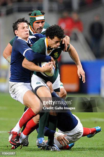 Zane Kirchner of South Africa tackled by Francois Trinh-Duc of France and Vincent Clerc of France during the International match between France and...
