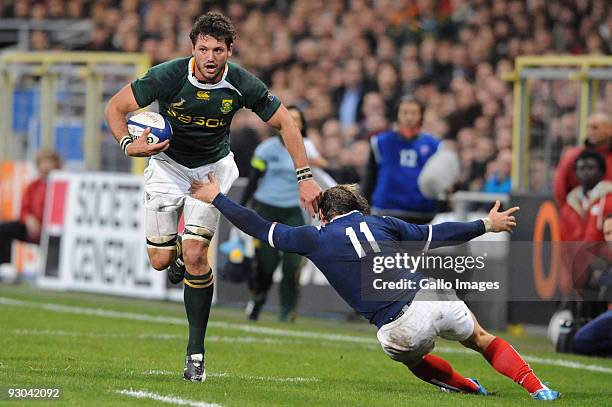 Ryan Kankowski of South Africa tackled by Cedric Heymans of France during the International match between France and South Africa at Toulouse Stadium...