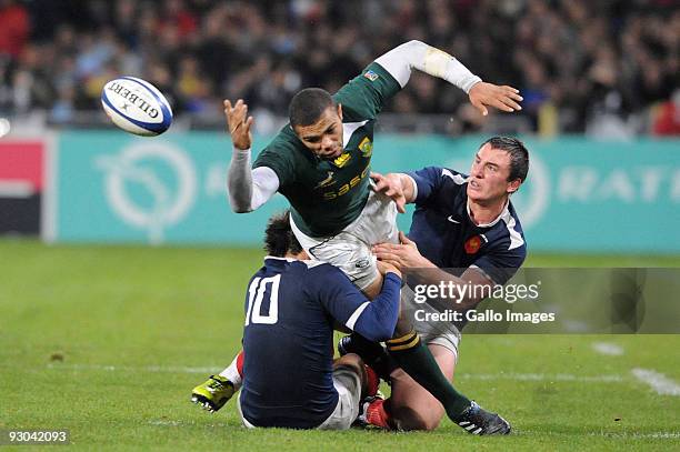 Francois Trinh-Duc of France and Maxime Mermoz of France tackle Bryan Habana of South Africa during the International match between France and South...