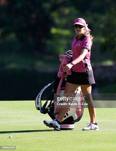 Paula Creamer of the United States walks her bag over to her ball in the 1th fairway during the second round of the Lorena Ochoa Invitational...