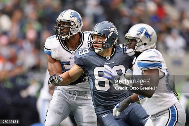 John Carlson of the Seattle Seahawks looks for the catch against Julian Peterson of the Detroit Lions on November 8, 2009 at Qwest Field in Seattle,...