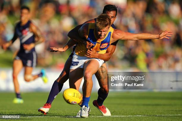 Danyle Pearce of the Dockers and Mark LeCras of the Eagles contest for the ball during the JLT Community Series AFL match between the Fremantle...