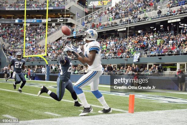 Wide receiver Calvin Johnson of the Detroit Lions makes a catch at the one-yard line against Marcus Trufant of the Seattle Seahawks on November 8,...