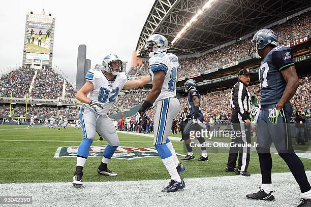 Casey FitzSimmons of the Detroit Lions celebrates after Bryant Johnson makes a catch in the endzone during the game against the Seattle Seahawks on...
