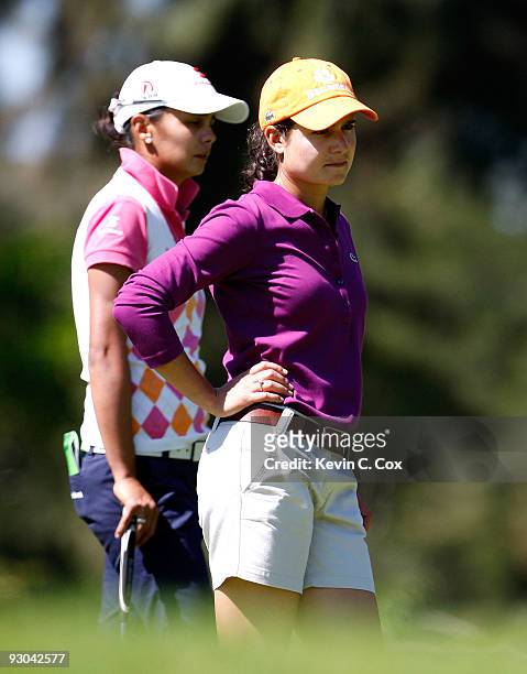 Loreno Ochoa stands next to Sophia Sheridan on the first green during the second round of the Lorena Ochoa Invitational Presented by Banamex and...