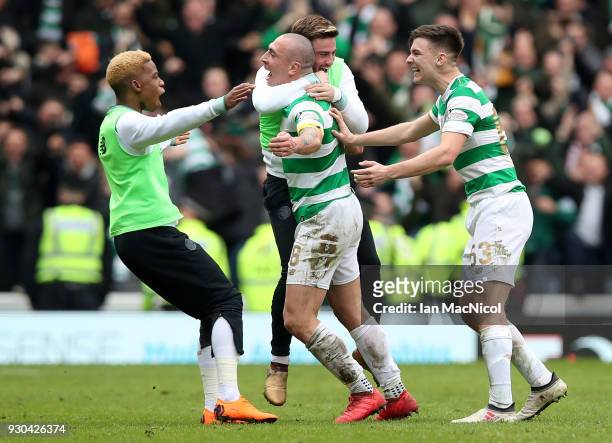 Scott Brown of Celtic and his team mates celebrate victory after the Ladbrokes Scottish Premiership match between Rangers and Celtic at Ibrox Stadium...