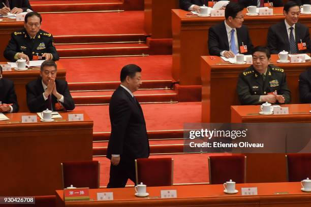 Chinese President Xi Jinping arrives for the third plenary session of the first session of the 13th National People's Congress at The Great Hall of...