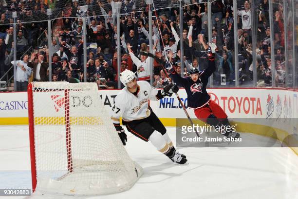 Rick Nash of the Columbus Blue Jackets celebrates his goal against the Anaheim Ducks late in the fist period as Scott Niedermayer skates by on...