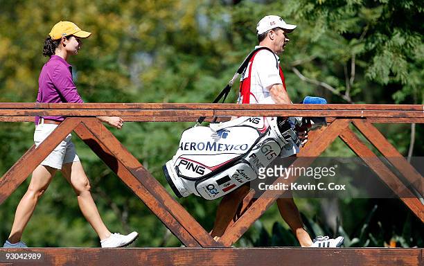 Loreno Ochoa and her caddie walk to the second tee during the second round of the Lorena Ochoa Invitational Presented by Banamex and Corona at...