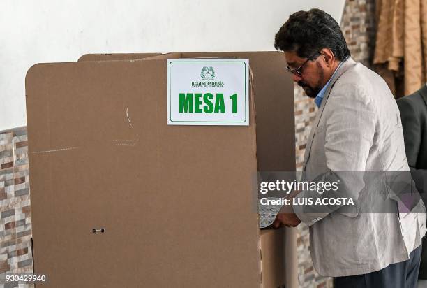 Ivan Marquez, senate candidate for the Common Alternative Revolutionary Force political party, votes during Colombia's parliamentary election, in...