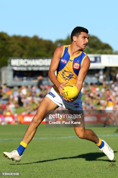 Thomas Cole of the Eagles looks to handball during the JLT Community Series AFL match between the Fremantle Dockers and the West Coast Eagles at HBF...