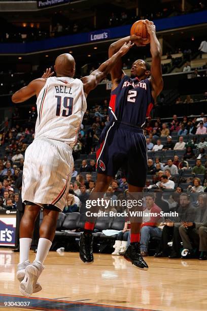 Joe Johnson of the Atlanta Hawks shoots under pressure against Raja Bell of the Charlotte Bobcats during the game on November 6, 2009 at Time Warner...