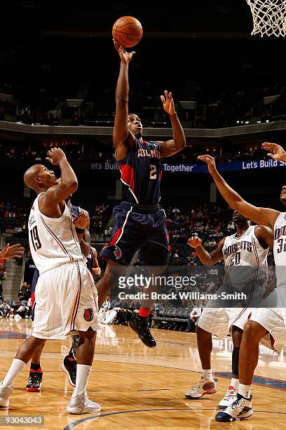 Joe Johnson of the Atlanta Hawks goes to the basket against Raja Bell of the Charlotte Bobcats during the game on November 6, 2009 at Time Warner...