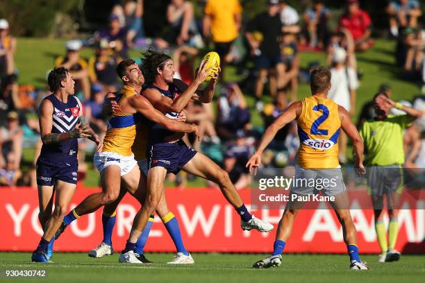Alex Pearce of the Dockers gets tackled during the JLT Community Series AFL match between the Fremantle Dockers and the West Coast Eagles at HBF...