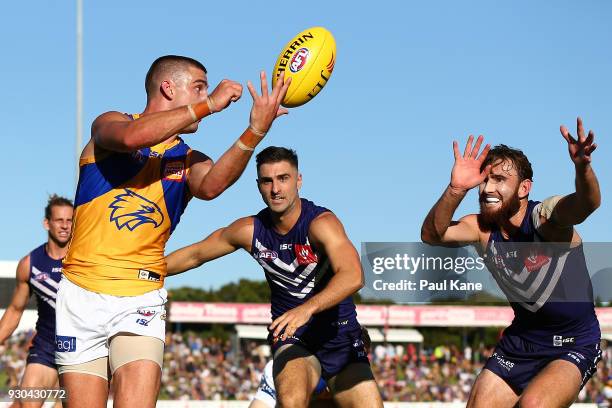 Elliot Yeo of the Eagles handballs during the JLT Community Series AFL match between the Fremantle Dockers and the West Coast Eagles at HBF Arena on...