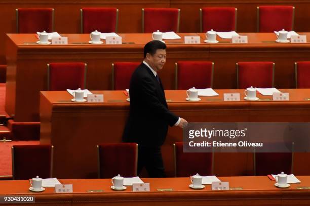 Chinese President Xi Jinping attends the third plenary session of the first session of the 13th National People's Congress at The Great Hall of...