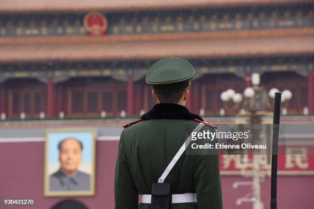 Soldier stands guard in front of Tiananmen square before the third plenary session of the first session of the 13th National People's Congress at The...