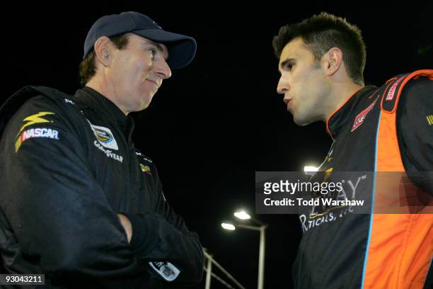 Mike Bliss , driver of the Harris Trucking Toyota, talks with Aric Almirola , driver of the Graceway Toyota, before the NASCAR Camping World Truck...