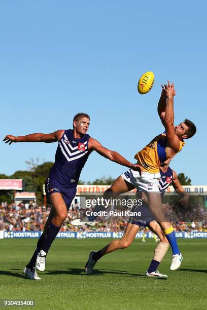 Fraser McInnes of the Eagles contests for a mark against Aaron Sandilands of the Dockers during the JLT Community Series AFL match between the...