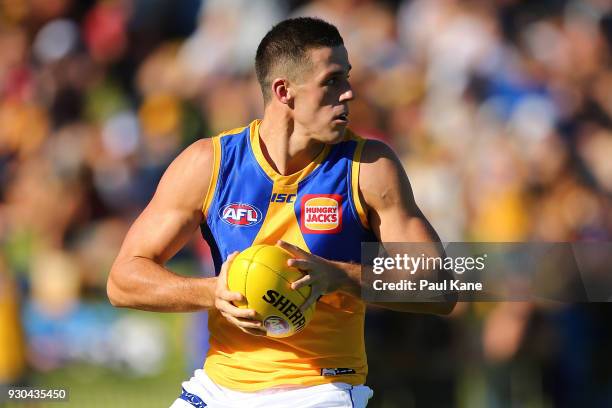 Jake Waterman of the Eagles looks to pass the ball during the JLT Community Series AFL match between the Fremantle Dockers and the West Coast Eagles...