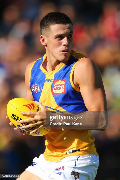 Jake Waterman of the Eagles looks to pass the ball during the JLT Community Series AFL match between the Fremantle Dockers and the West Coast Eagles...
