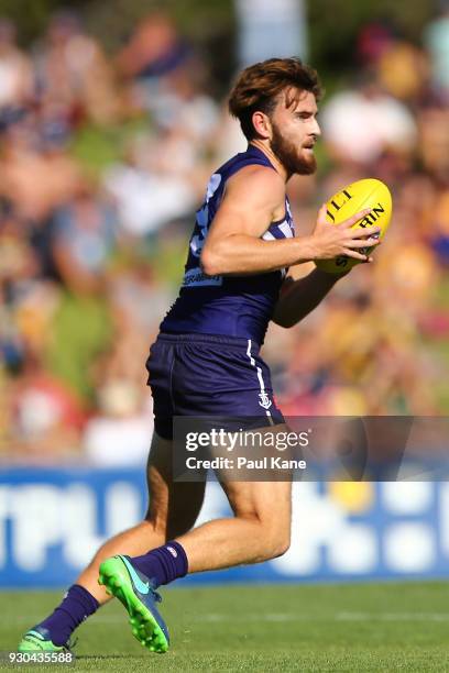 Connor Blakely of the Dockers looks to pass the ball during the JLT Community Series AFL match between the Fremantle Dockers and the West Coast...