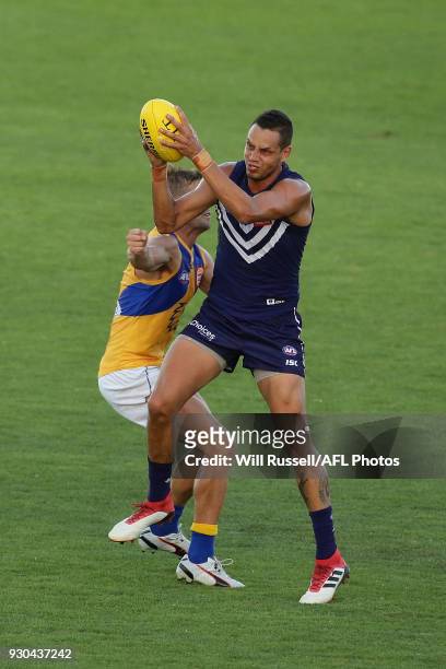 Michael Johnson of the Dockers marks the ball during the JLT Community Series AFL match between the Fremantle Dockers and the West Coast Eagles at...