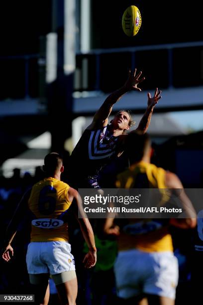 Nat Fyfe of the Dockers takes an overhead mark during the JLT Community Series AFL match between the Fremantle Dockers and the West Coast Eagles at...