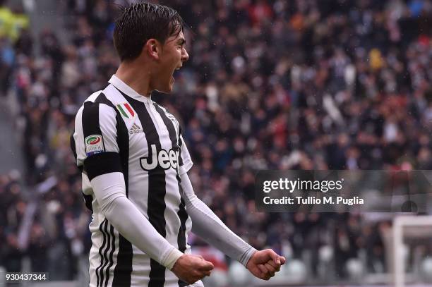 Paulo Dybala of Juventus celebrates after scoring the opening goal during the serie A match between Juventus and Udinese Calcio on March 11, 2018 in...