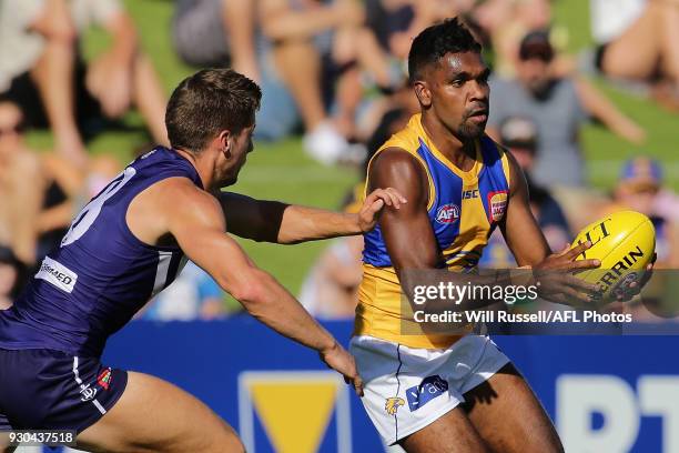 Liam Ryan of the Eagles is tackled by Darcy Tucker of the Dockers during the JLT Community Series AFL match between the Fremantle Dockers and the...
