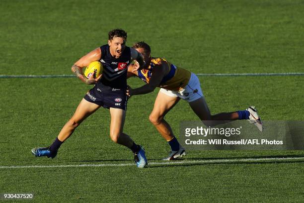 Nathan Wilson of the Dockers fends off Mark LeCras of the Eagles during the JLT Community Series AFL match between the Fremantle Dockers and the West...