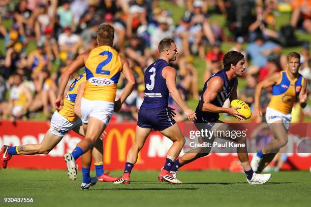 Alex Pearce of the Dockers looks to pass the ball during the JLT Community Series AFL match between the Fremantle Dockers and the West Coast Eagles...