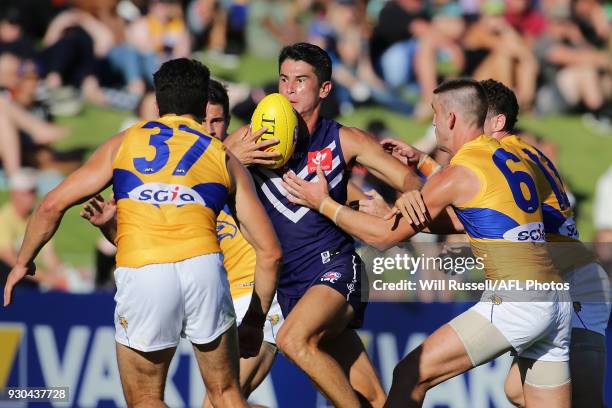 Bailey Banfield of the Dockers runs with the ball during the JLT Community Series AFL match between the Fremantle Dockers and the West Coast Eagles...