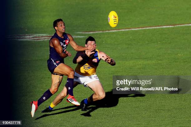 Danyle Pearce of the Dockers and Jeremy McGovern of the Eagles go to mark the ball during the JLT Community Series AFL match between the Fremantle...