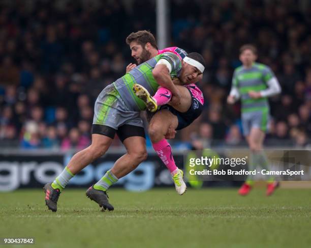 Exeter Cheifs' Santiago Cordero is tackled by Newcastle Falcons' Joel Matavesi during the Anglo Welsh Cup Semi Final match between Exeter Chiefs and...