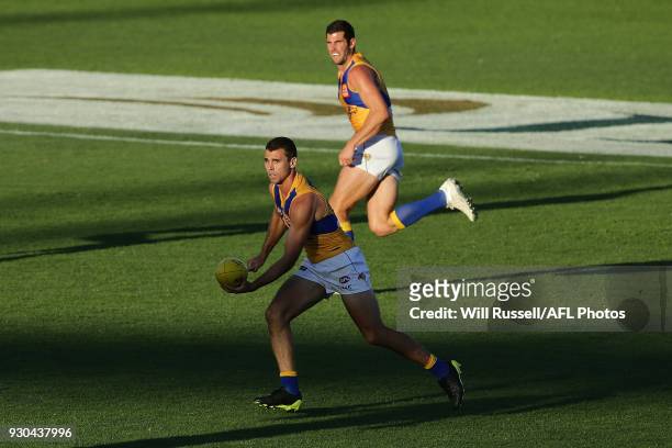 Jamie Cripps of the Eagles looks to pass the ball during the JLT Community Series AFL match between the Fremantle Dockers and the West Coast Eagles...