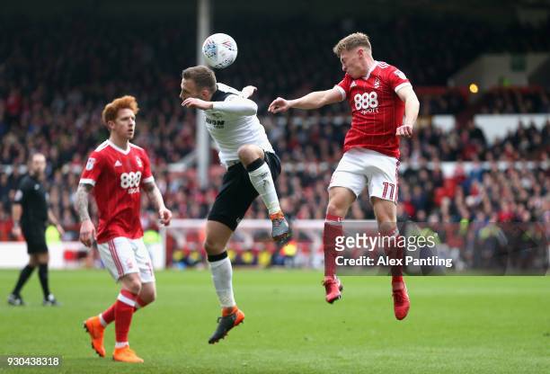 Andreas Weimann of Derby County and Ben Osborn of Nottingham Forest in action during the Sky Bet Championship match between Nottingham Forest and...