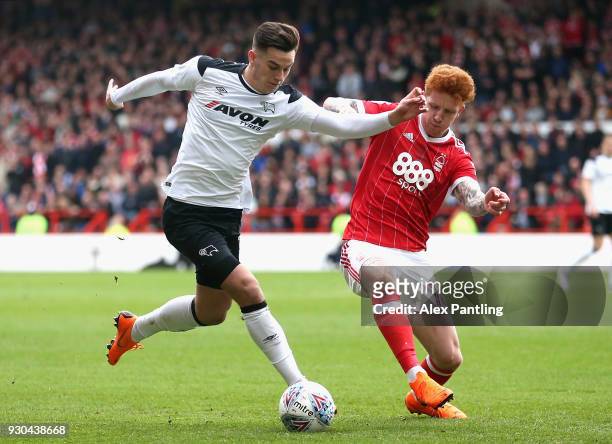 Jack Colback of Nottingham Forest and Tom Lawrence of Derby County in action during the Sky Bet Championship match between Nottingham Forest and...