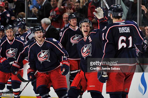 Antoine Vermette comes out to congratulate Rick Nash, both of the Columbus Blue Jackets, after Nash scored the game winning goal in a shootout...