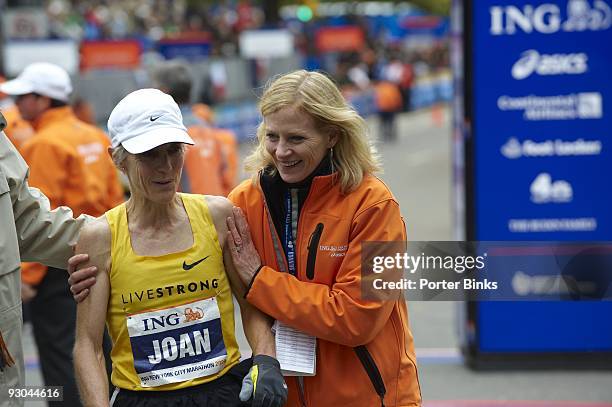 New York City Marathon: USA Joan Benoit Samuelson with NYRR president Mary Wittenberg after crossing finish line in Central Park. New York, NY...