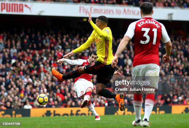 Henrikh Mkhitaryan of Arsenal scores the 3rd Arsenal goal during the Premier League match between Arsenal and Watford at Emirates Stadium on March...