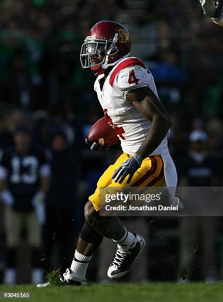 Joe McKnight of the USC Trojans runs against the Notre Dame Fighting Irish at Notre Dame Stadium on October 17, 2009 in South Bend, Indiana. USC...