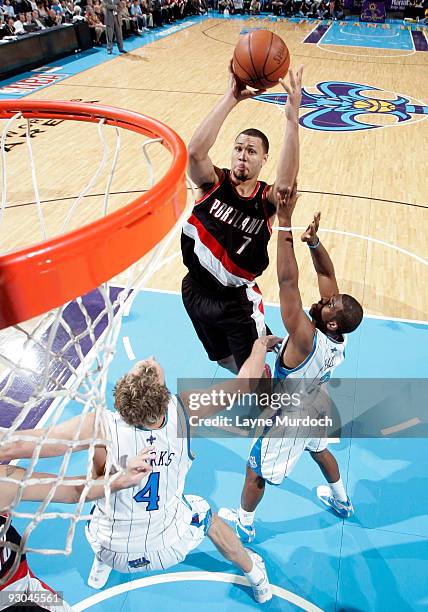 Brandon Roy of the Portland Trail Blazers shoots over Sean Marks and Chris Paul of the New Orleans Hornets on November 13, 2009 at the New Orleans...