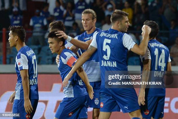 Bengaluru FC players celebrate their first goal scored by captain Sunil Chhetri during the Hero Indian Super League football semifinal second leg...