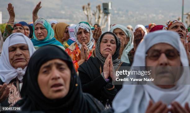 Kashmiri Muslim women devotees pray, at Hazratbal shrine to mark the anniversary of Hazrat Abu Bakr Siddiq, the senior companion and the...